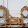 This set resembles a Baroque style teakwood sofa and table set, often referred to as “royal” or “palace” furniture.